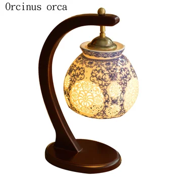 Jaunais Ķīnas klasiskā dobi led keramikas galda lampas guļamistabas gultas lampa Amerikas Pastorālo radošo masīvkoka galda lampas